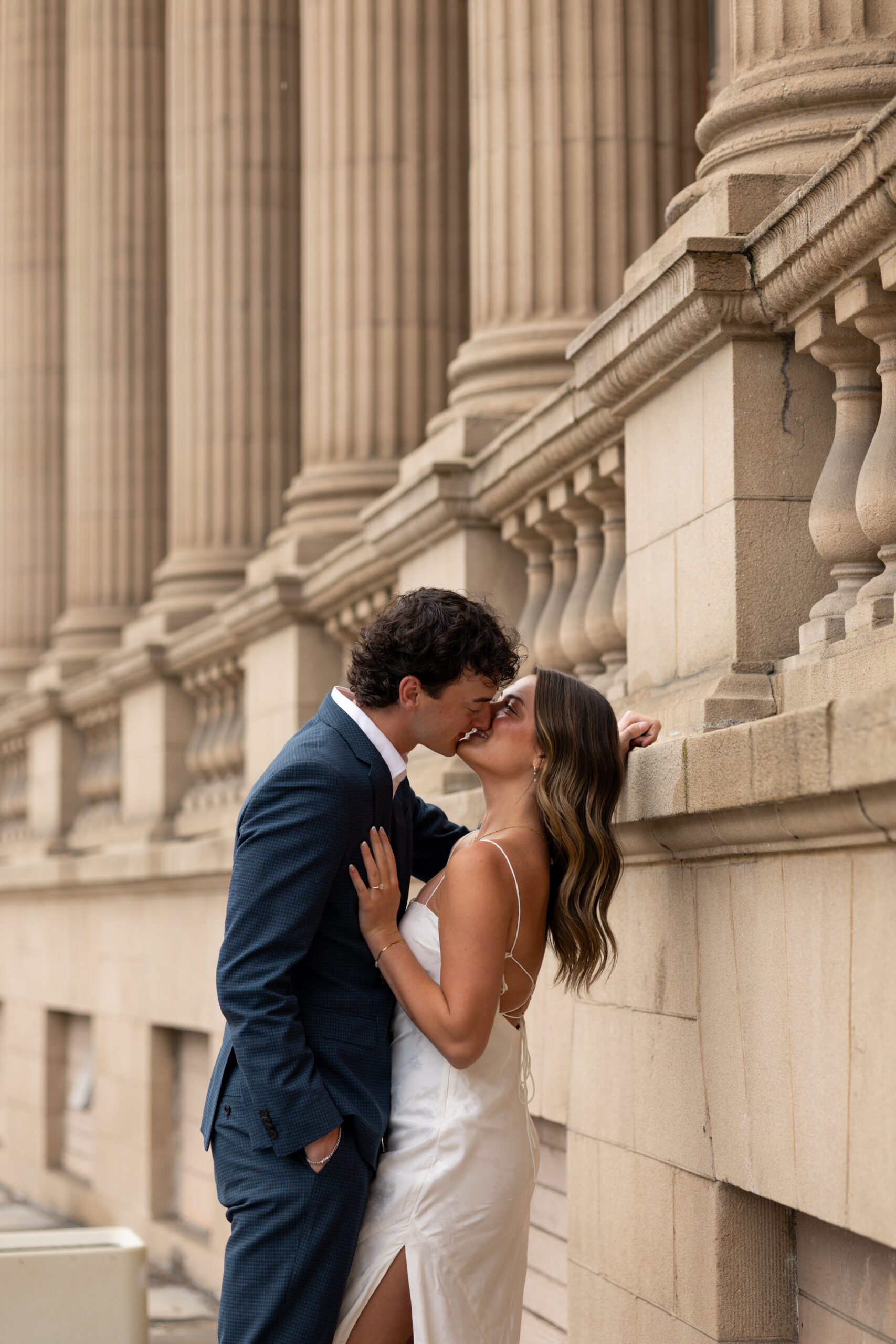 Engaged couple kissing in Spokane Washington