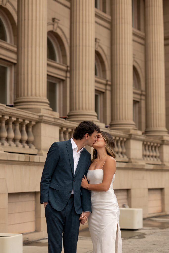 Couple kissing and holding hands taken by Spokane Washington Photographer