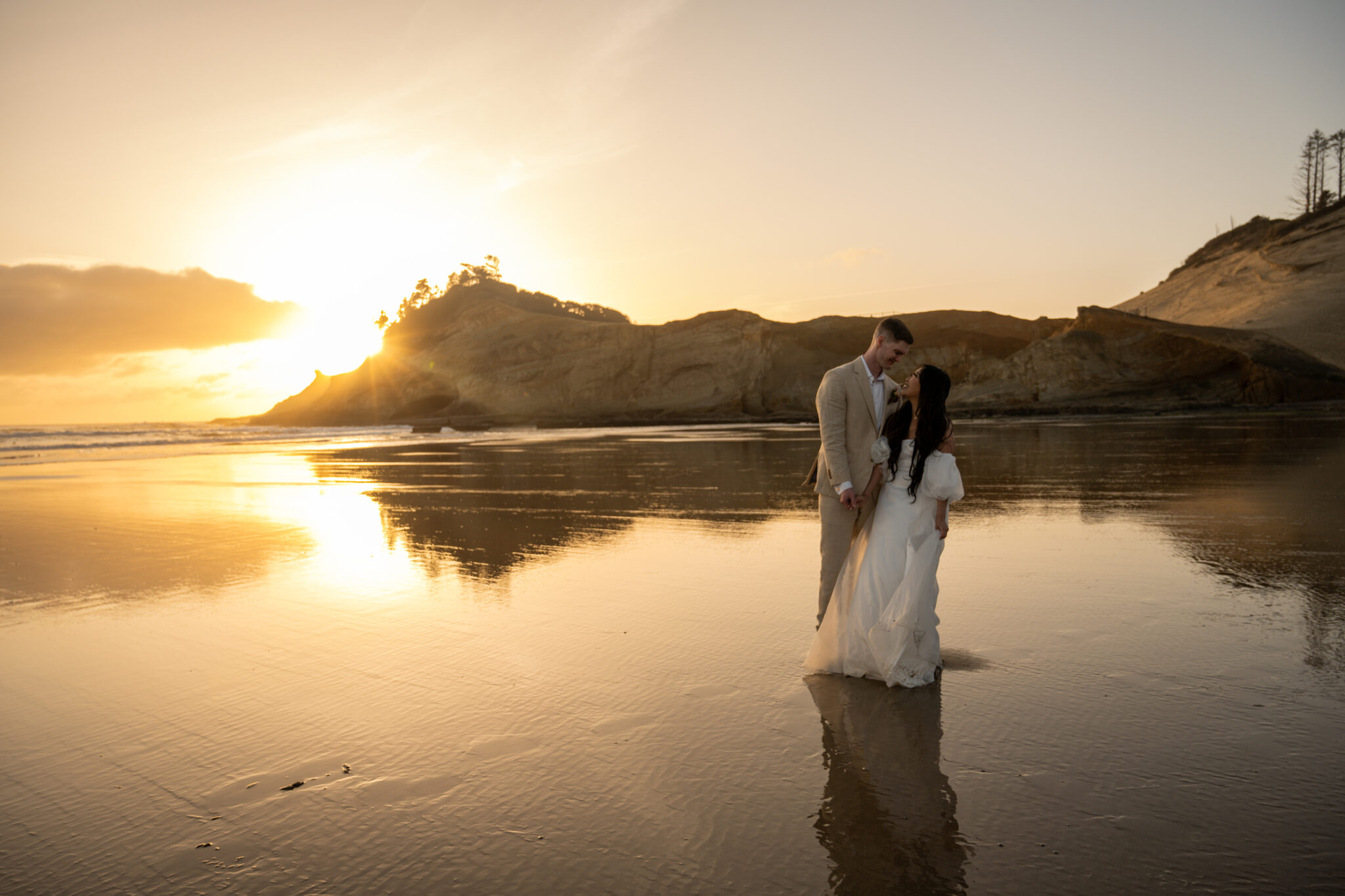 Elopement couple on the beach in Cape Kiwanda Oregon.