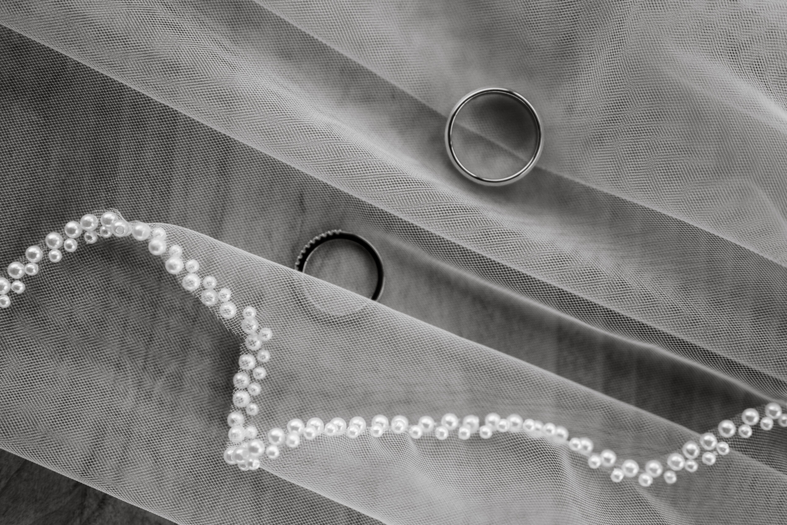 Wedding rings in veil taken by Idaho wedding photographer.