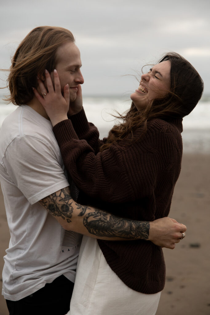 Engaged couple laughing taken by Oregon engagement photographer.