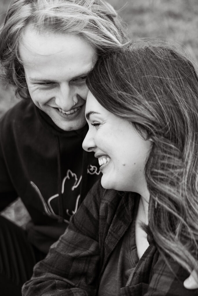 Engaged couple smiling taken by Oregon engagement photographer.