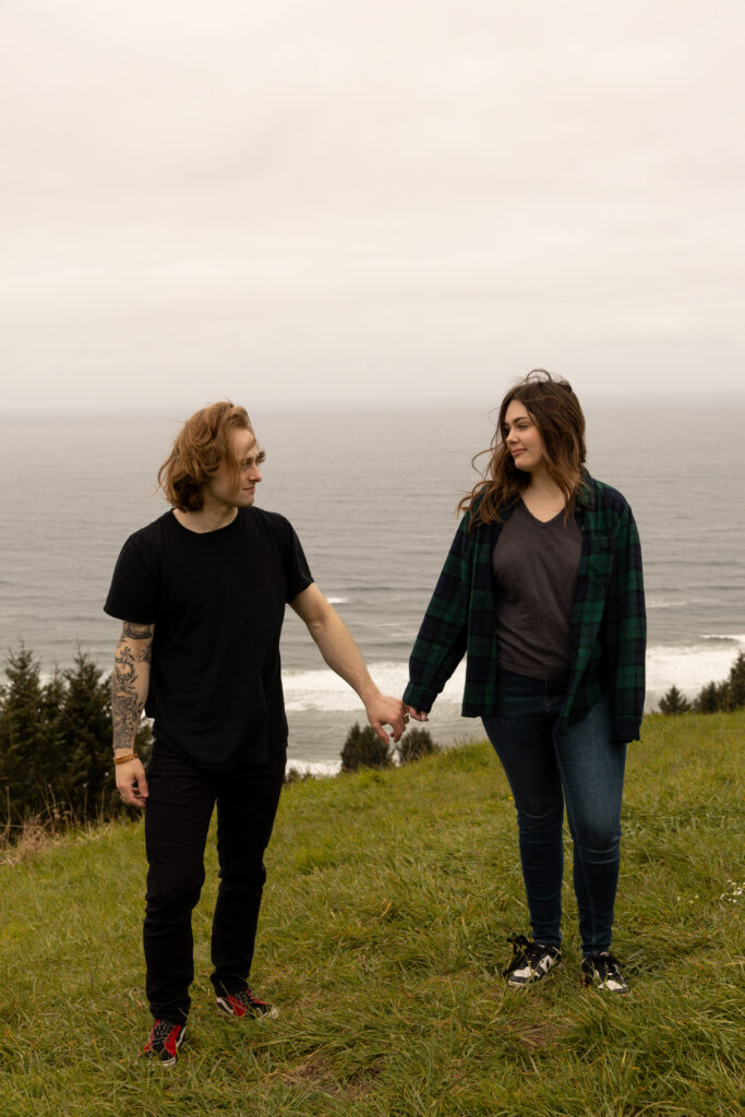 Engaged couple holding hands taken by Oregon engagement photographer.