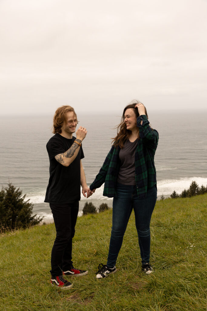 Engaged couple holding hands taken by Oregon engagement photographer.