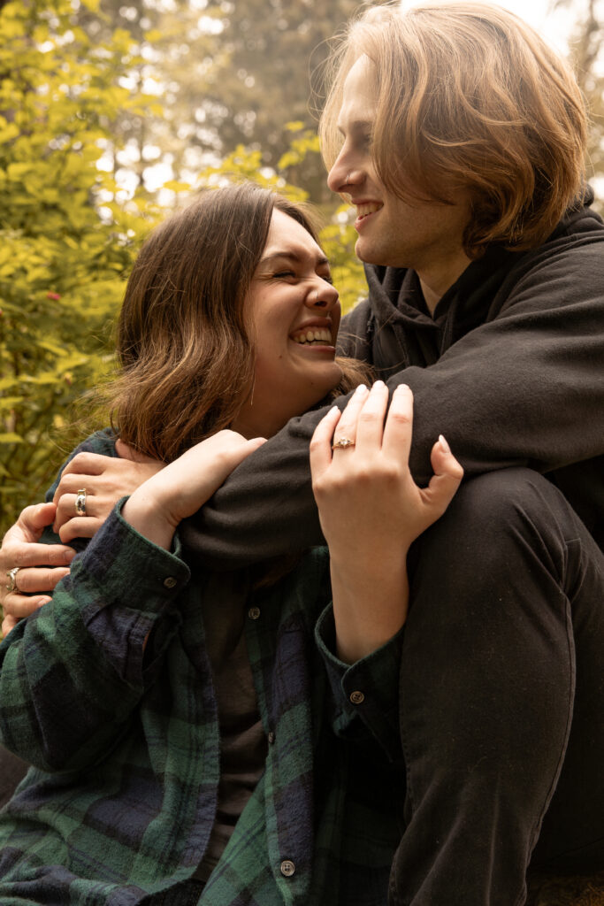 Engaged couple smiling taken by Oregon engagement photographer.