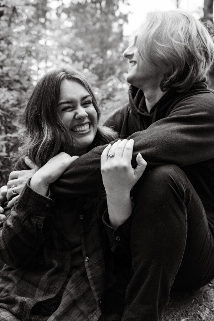 Engaged couple hugging taken by Oregon engagement photographer.