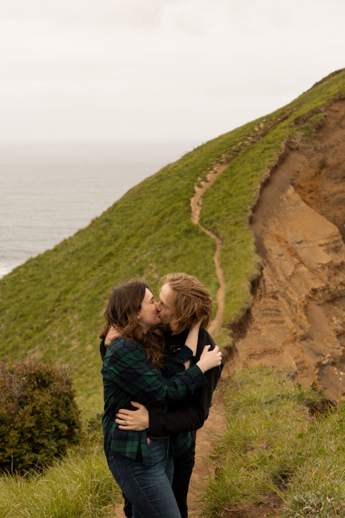 Engaged couple kissing taken by Oregon engagement photographer.