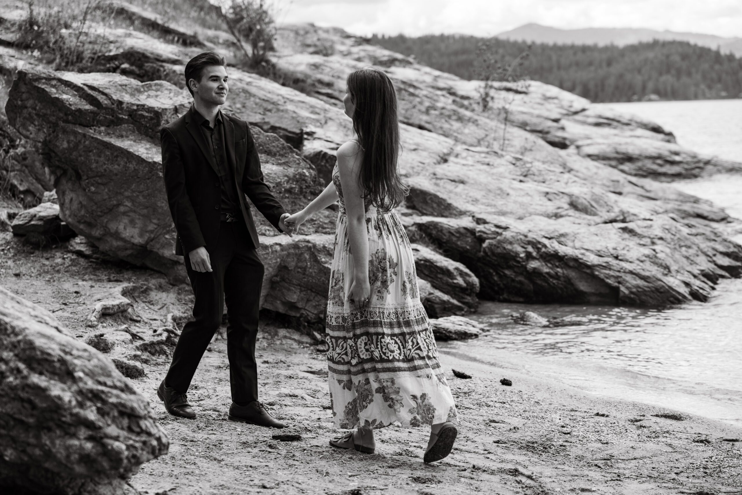 Engaged couple walking taken by photographers in Idaho