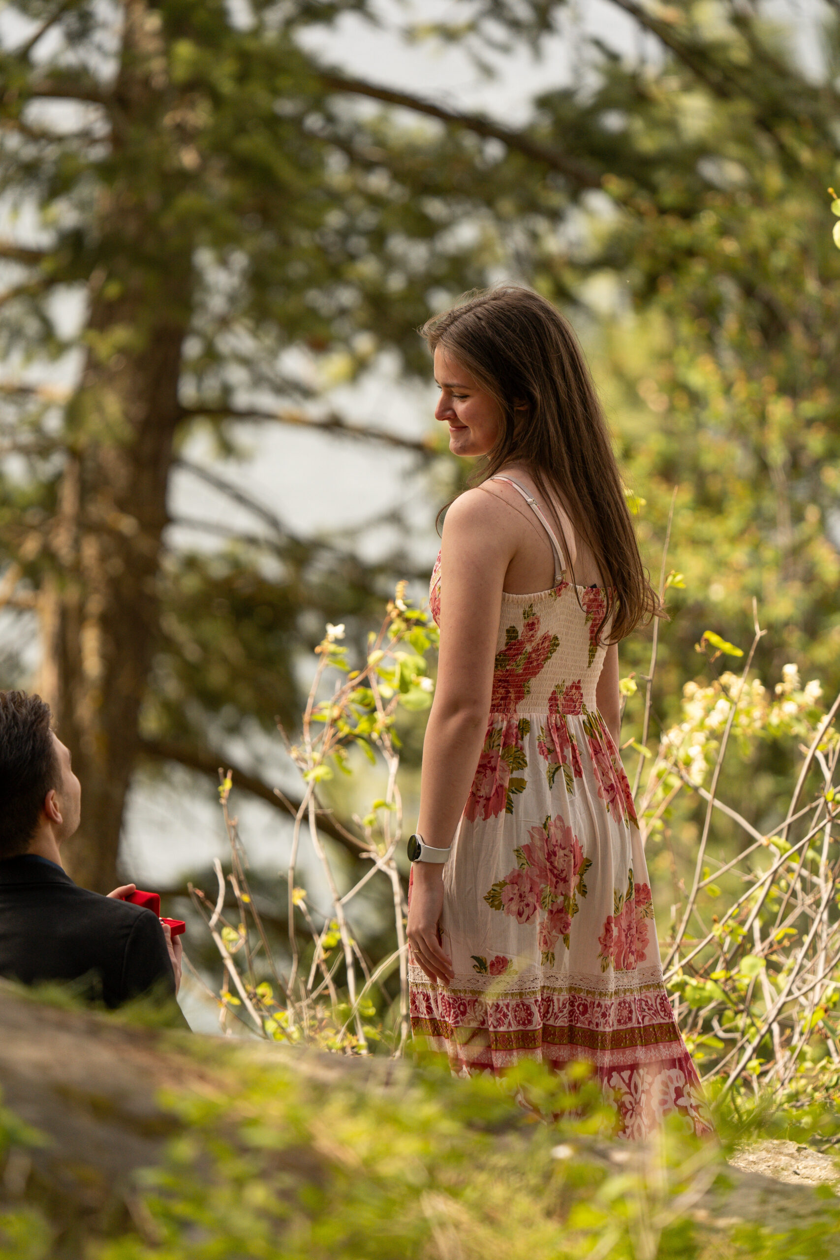 Girl looking at ring taken by proposal photographer
