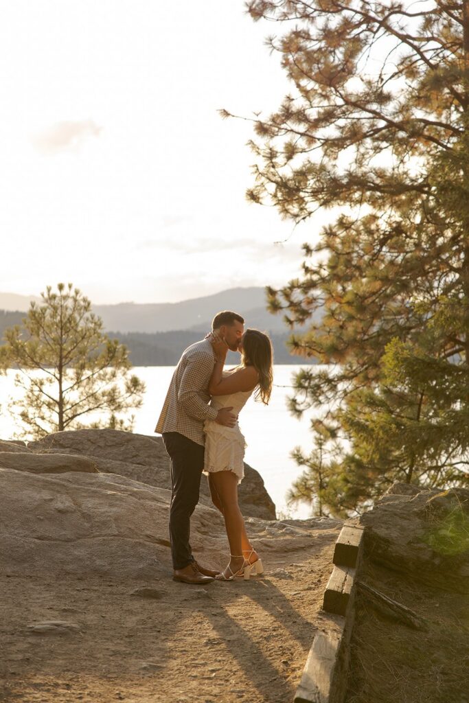 Couple kissing at a lake preparing to elope in Idaho