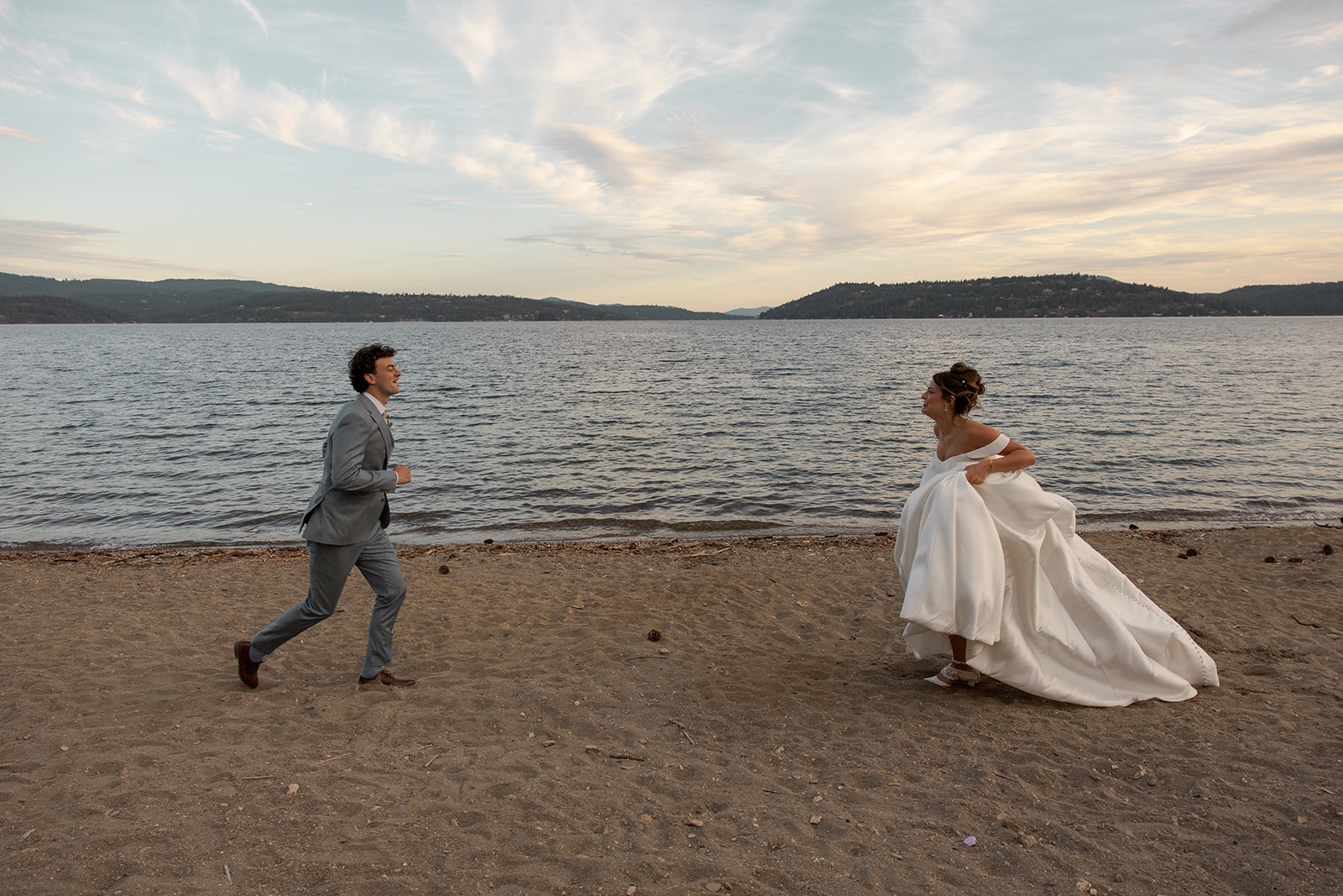 Couple running toward each other while eloping in Idaho