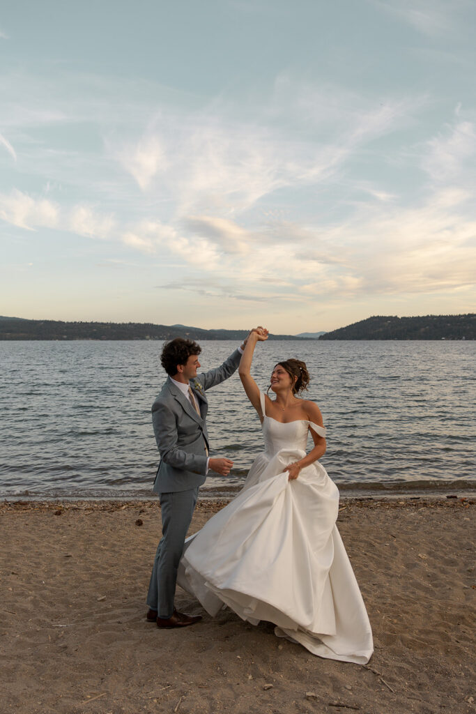 Best Places to Elope in Idaho | | Love in the Hills Photo & Video Newlyweds dancing on the beach at sunset in one of the best places to elope in Idaho.