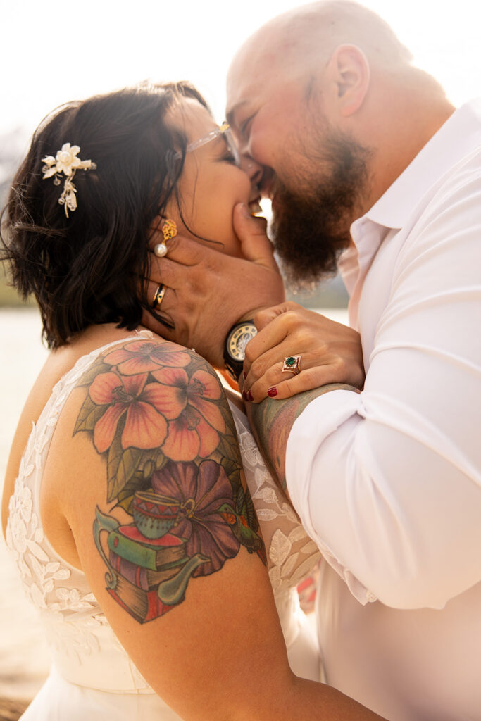 Bride and groom share a kiss and smile during their Idaho elopement