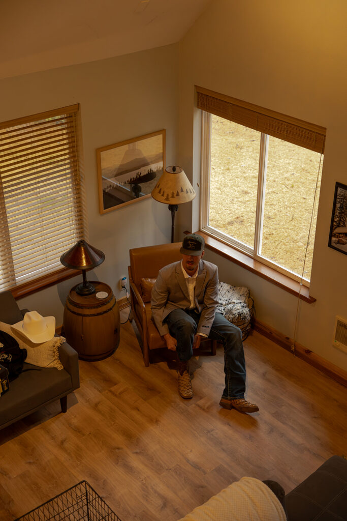 Priest Lake Wedding | Love In The Hills Photo And Video Groom getting ready inside a cabin before his Priest Lake wedding.