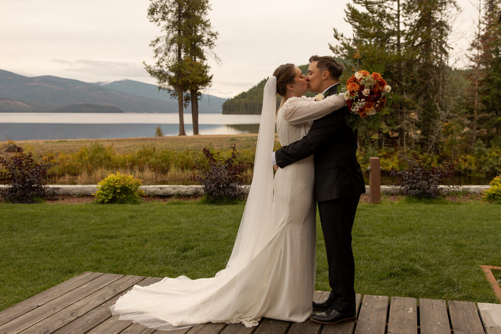 Priest Lake Idaho Wedding | Love In The Hills Photo And Video Lakeside portrait from a Priest Lake wedding overlooking the mountains and shoreline.